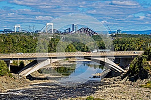 Highway Bridge Over Chaudiere River With Quebec City In Background