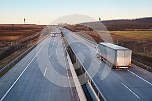 Highway with cargo trucks