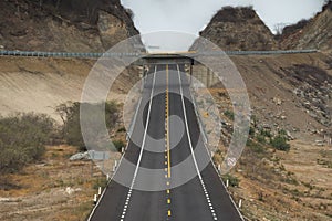 Highway crossing two mountains with tilt up