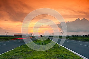 Highway on dusk with movement of vehicle