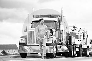 Highway engineer walking on highway. Man wearing safety vest for traffic work. Highway engineering