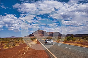 Highway at the foot ofMount Bruce in the outback of Karajini, Western Australia