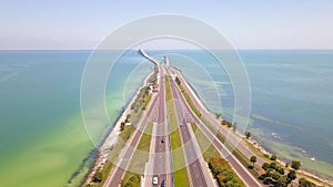 Highway or Freeway road. Ocean or Gulf of Mexico. Road for cars and truck. Low traffic on the way. Highway for any transportation.