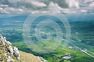 Highway through the green countryside of Slovenia from the peak of Plesa