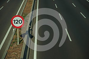 Highway with heavy traffic and SPEED LIMIT signs in Madrid