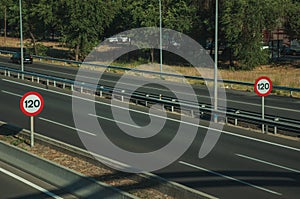 Highway with heavy traffic and SPEED LIMIT signs in Madrid photo