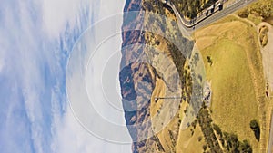 Highway and Hilly Rural Landscape. Kern County. California, USA. Aerial View. Vertical Video