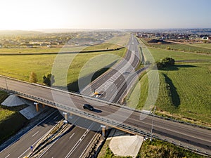 Highway intersection junction summer morning with car. Drone Aerial Top View