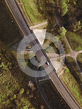 Highway intersection junction summer morning with car. Drone Aerial Top View