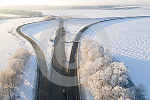 Highway intersection junction winter morning with car. Drone Aerial Top View