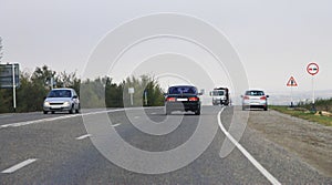 Highway landscape with moving cars at daytime