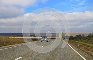 Highway landscape with moving cars at daytime