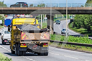 Highway maintenance tipper lorry truck on uk motorway in fast motion