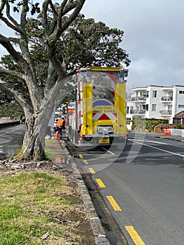 Highway maintenance and traffic safety vehicle with traffic cones and signs - road works concept. Auckland waterfront