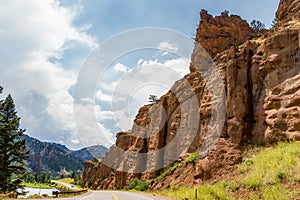 A highway between a mountain in range in summer