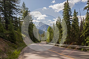 Highway in mountains Trans Canada Highway with a perfect asphalt at sunrise in summer. Banff, Alberta, Canada