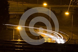 Highway at night with long exposure lights from cars and traffic in Schiedam, The Netherlands making an abstract image.