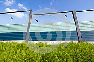 Highway noise barrier