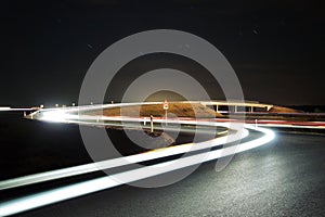 Highway overpass with car lights