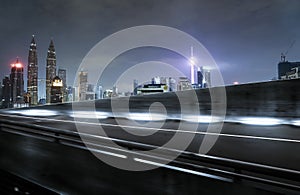 Highway overpass motion blur with city background