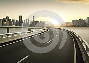 Highway overpass motion blur with city skyline backgroun