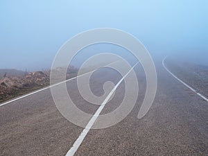 Highway through the pass in thick fog