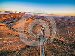 Highway passing through Flinders Ranges at dusk.