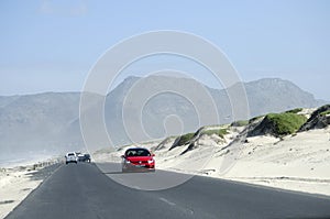 Highway passing sand dunes in South Africa