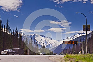 Highway passing through snow-capped mountains