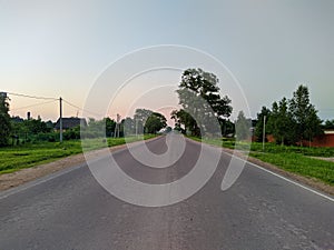 highway in a populated rural area in the evening