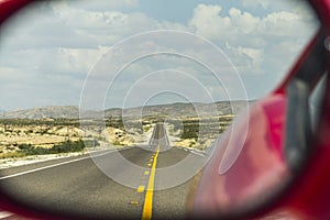 Highway through rear mirror