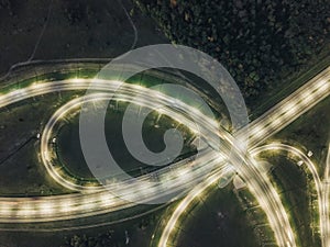 Highway road Junction at night, top view from drone