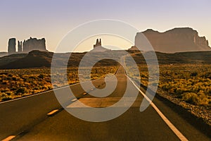 Highway Road U.S. Highway 163 and Monument Valley at sunset, Arizona, USA