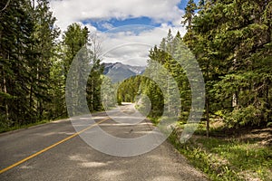 Highway in Rocky mountains, Trans Canada Highway with a perfect asphalt at sunrise in summer. Banff, Alberta, Canada