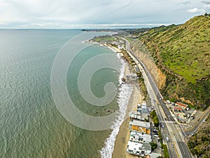 Highway Route 1 California. Aerial Panorama of the coastline and road. Green hills and beach on side