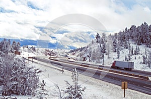 Highway running through a mountain pass in winter
