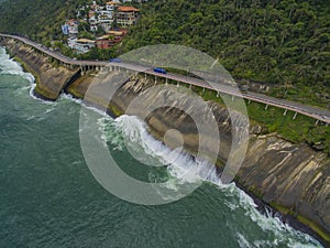 Highway by the sea and bike path. Asphalt road beside the sea. Car advertising background.