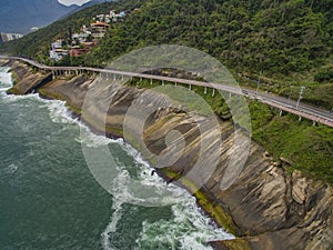 Highway by the sea. Wonderful road and bike path. Bicycle and road track and next to the blue sea in the city of Rio de Janeiro.