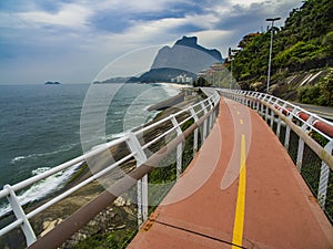 Highway by the sea. Wonderful road and bike path. Tim Maia bike path on Niemeyer Avenue, Rio de Janeiro, Brazil, South America.