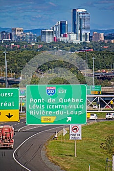 Highway Sign Leads Traffic To Highway 20 With Quebec City In The Background