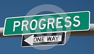 Highway sign with PROGRESS and ONE WAY