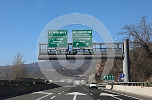 highway sign with the signs of the junction to go to Florence on photo