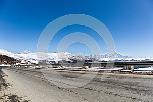 Highway with snow mountain