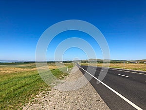 Highway on a Sunny summer day with a blue sky.
