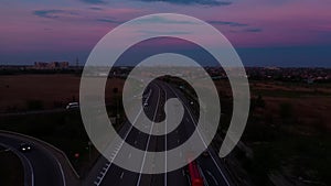 Highway at sunset from above, road with cars and trucks