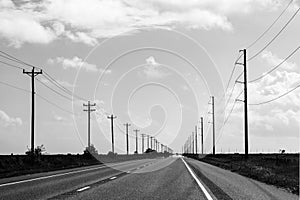 highway in texas with wooden eletrical pylons at the side, Texas, Willie photo