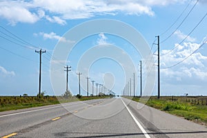 highway in texas with wooden eletrical pylons at the side, Texas, Willie photo