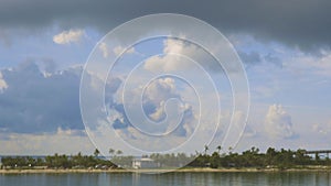 Highway to Key West Florida. View of old abandoned bridge and coast line of Atlantic ocean on blue sky.