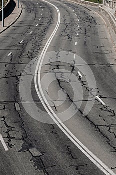 Highway traffic road. Asphalt road and white dividing lines. Road patches.