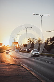 Highway transportation with cars and Truck at sunset